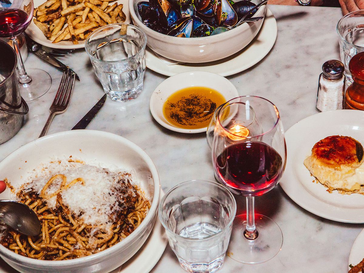 A table full of food dishes.