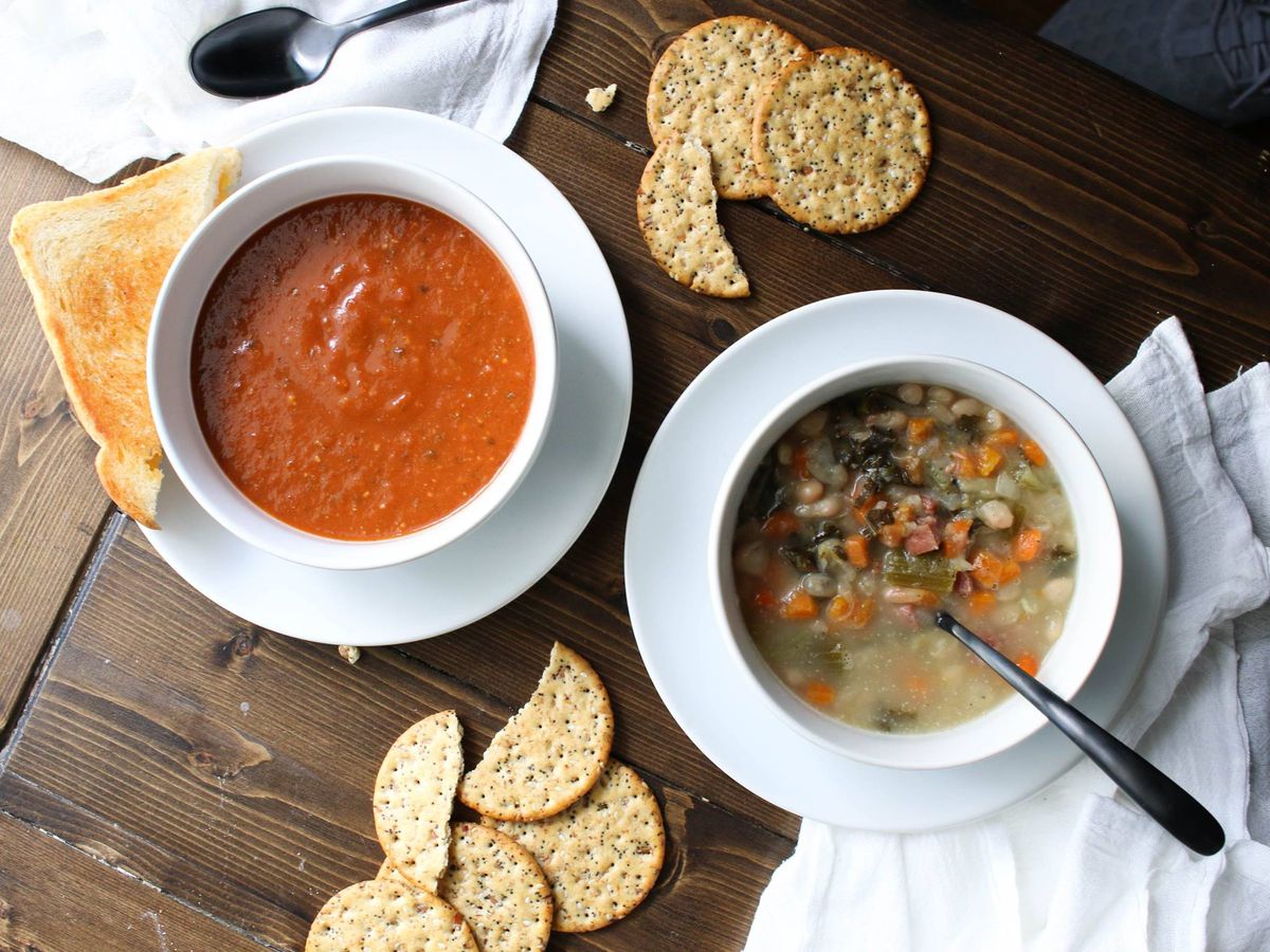 Two bowls of soup on a table.