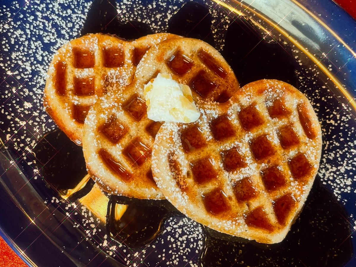 Heart-shaped waffles on a plate.