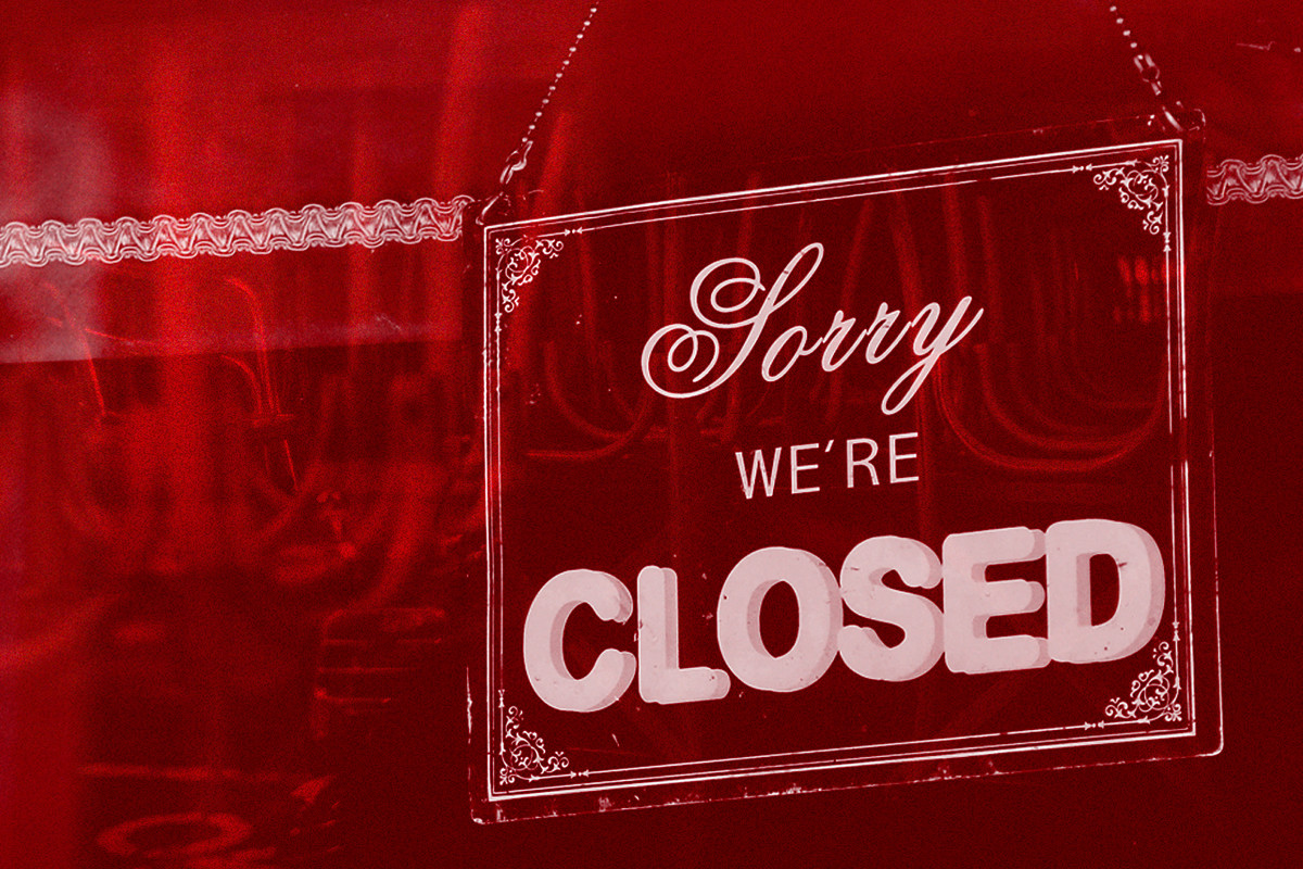 A red graphic of a sign that says “Sorry we’re closed.”