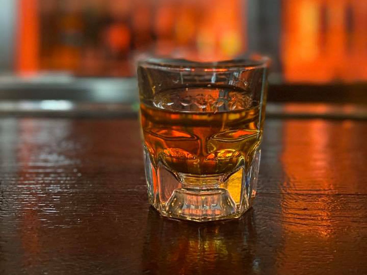 A glass of whiskey.