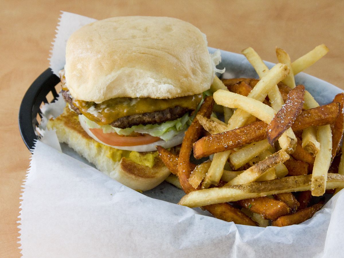A burger with fries.