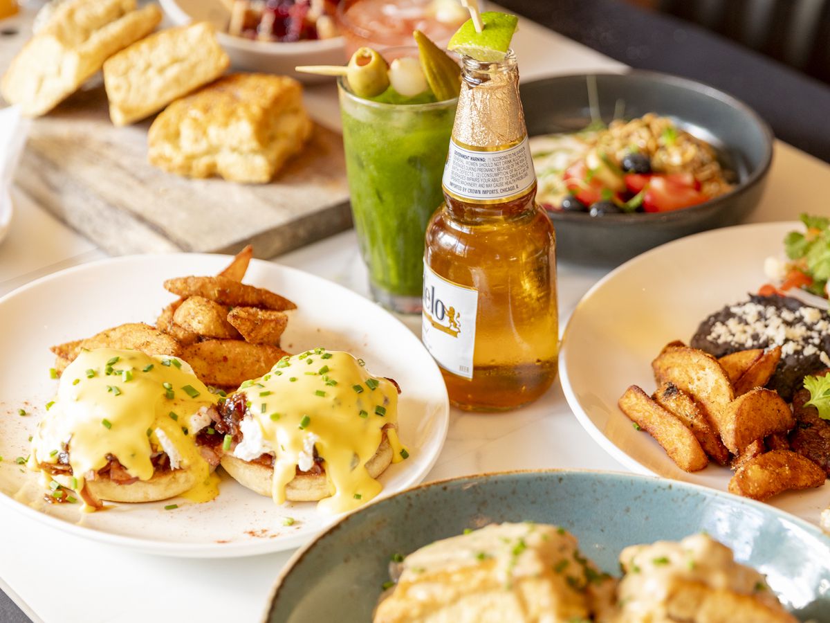 A table of food on plates and drinks.