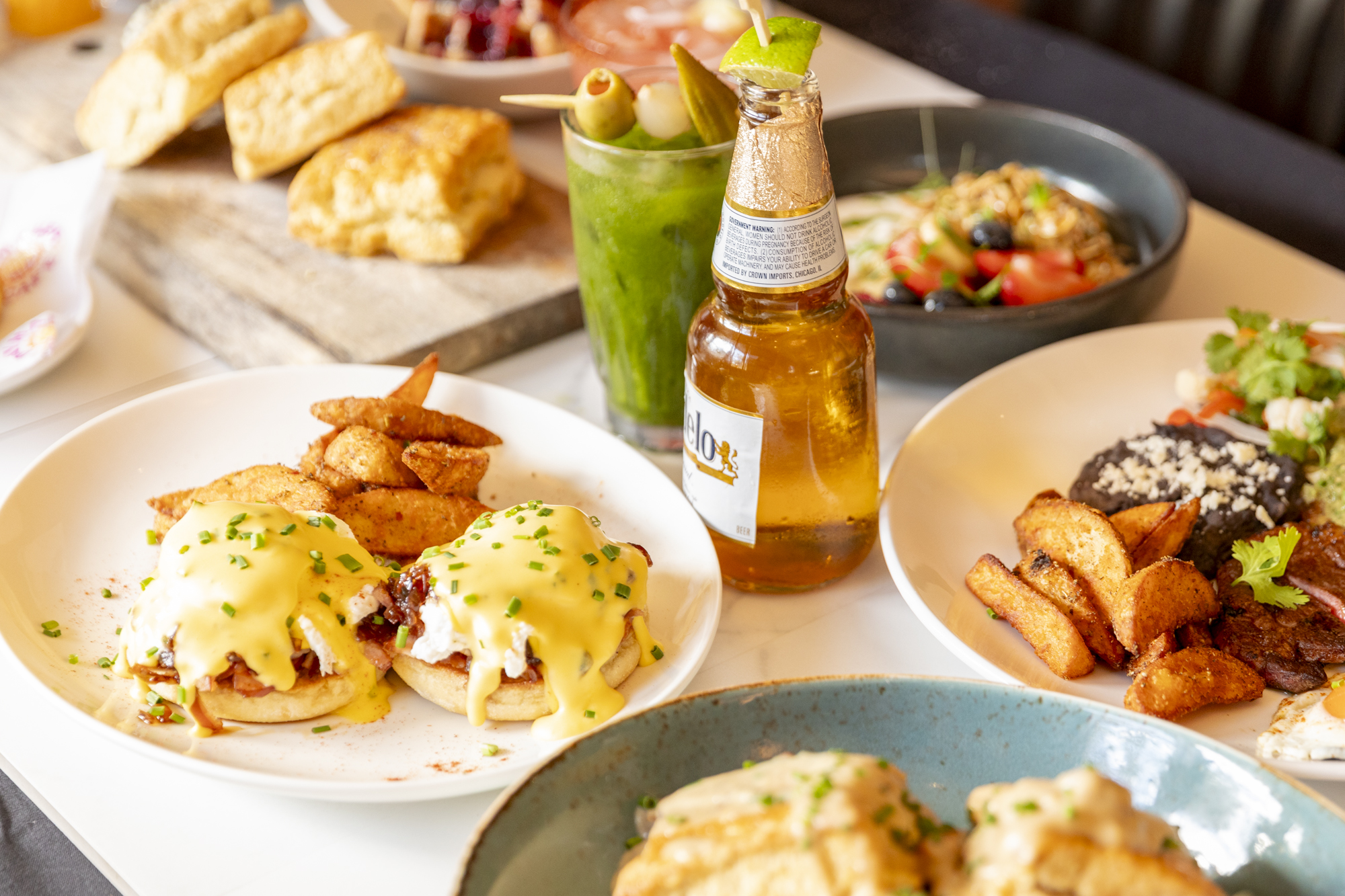 A table of food on plates and drinks.