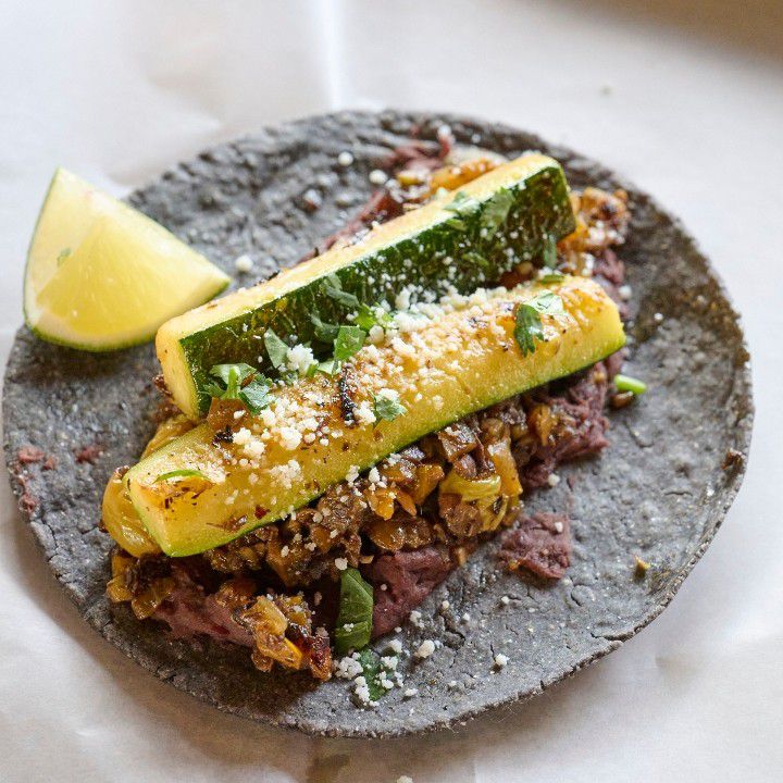 Verduras tacos with mushroom picadillo, grilled zucchini, and refried negros.