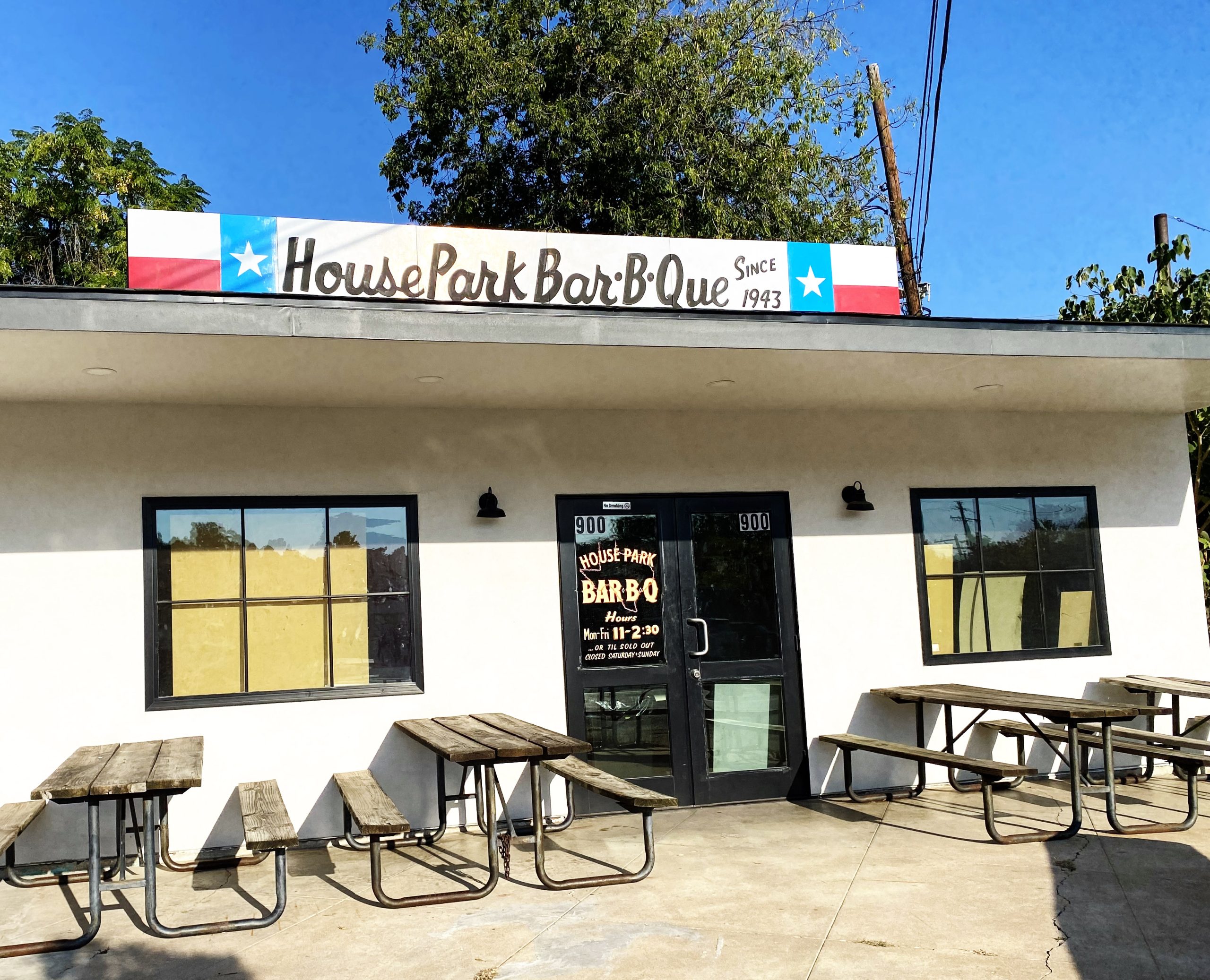 A restaurant exterior with a sign that reads “House Park Bar-B-Que” above the building.