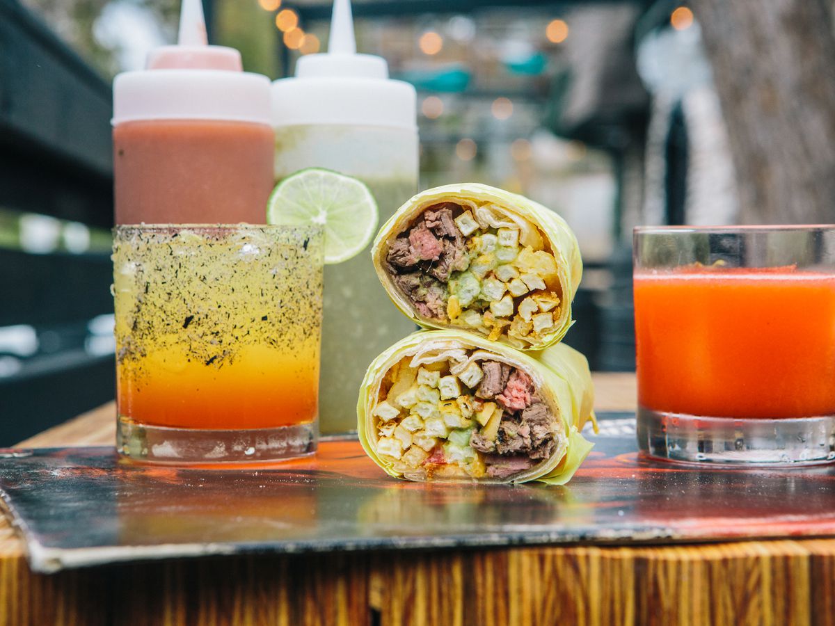 The San Diego burrito at Troublemaker, along with some cocktails