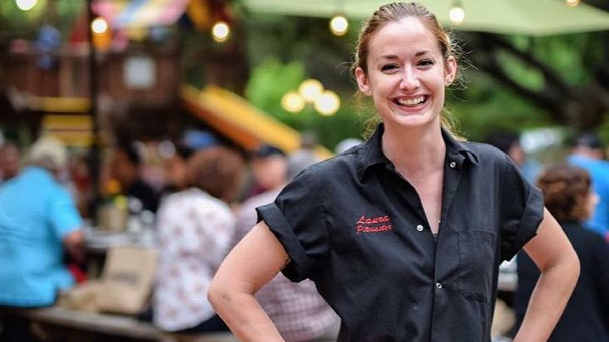 Pitmaster Laura Loomis poses for a photo at Two Bros BBQ Market.