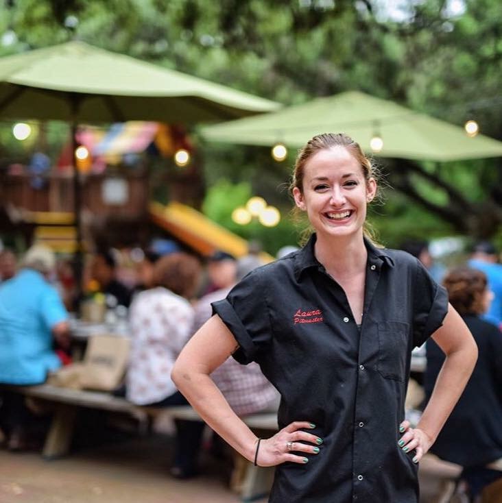 Pitmaster Laura Loomis poses for a photo at Two Bros BBQ Market.