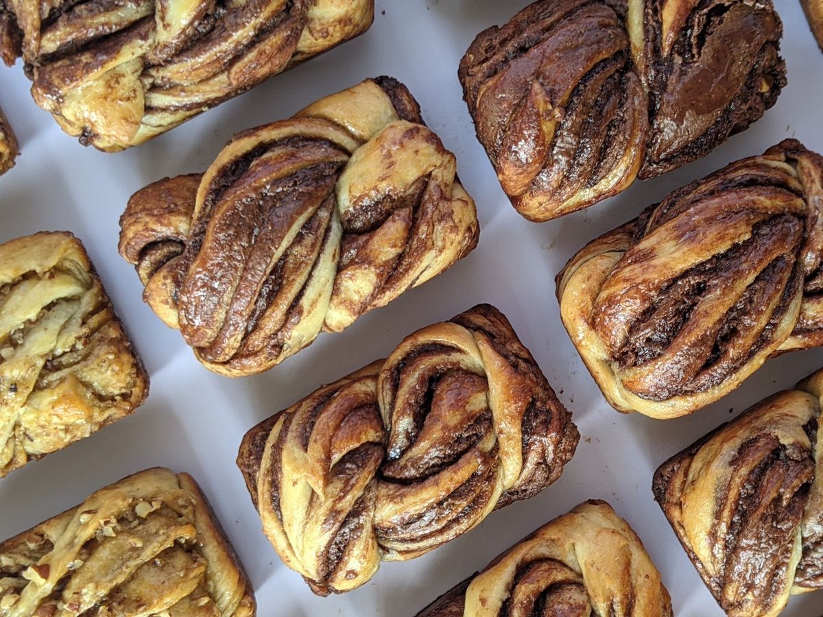 A bunch of braided loaves of bread.