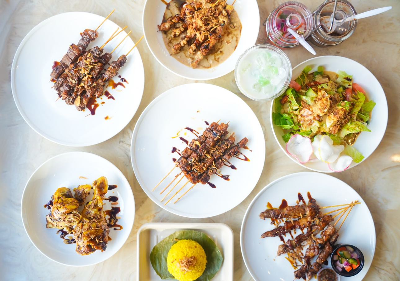 Plates of food seen from above. 