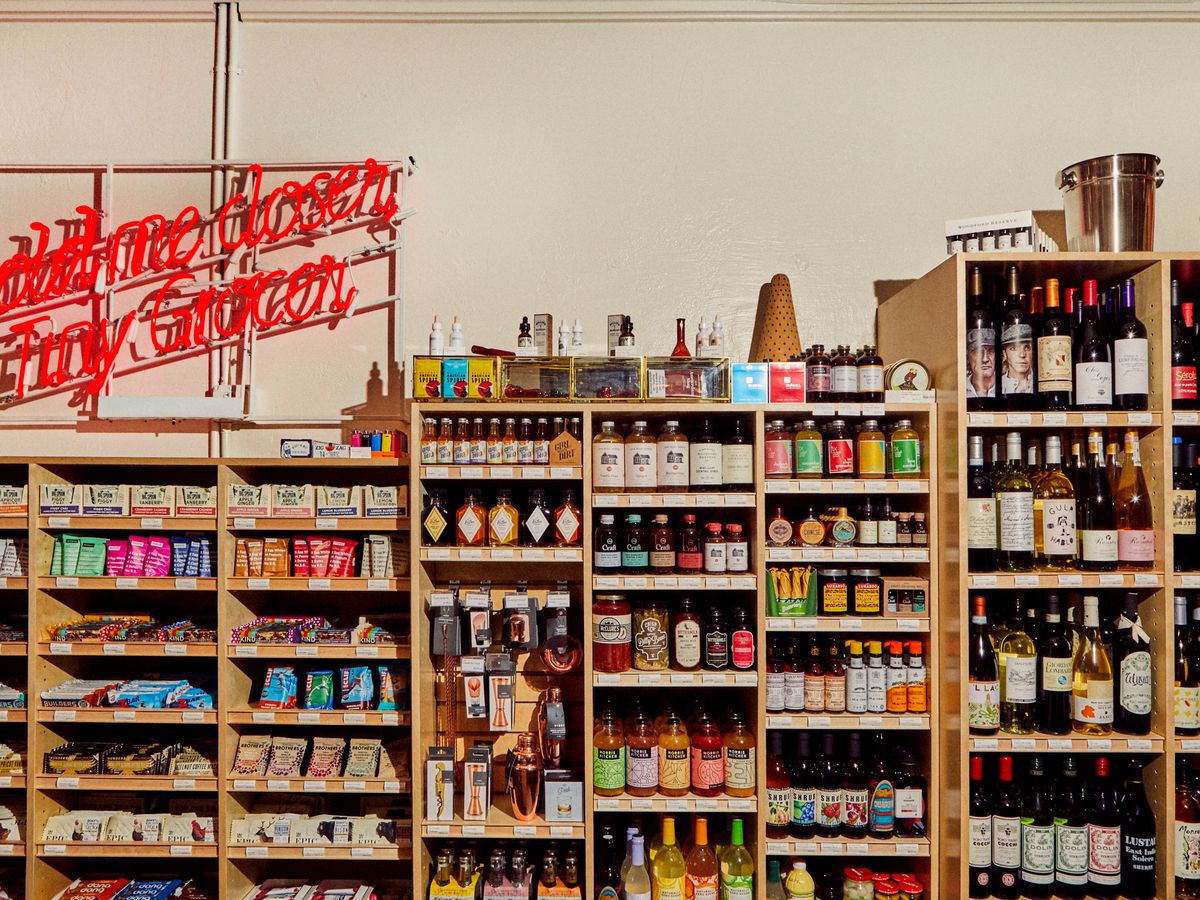A grocery store shelves with goods.
