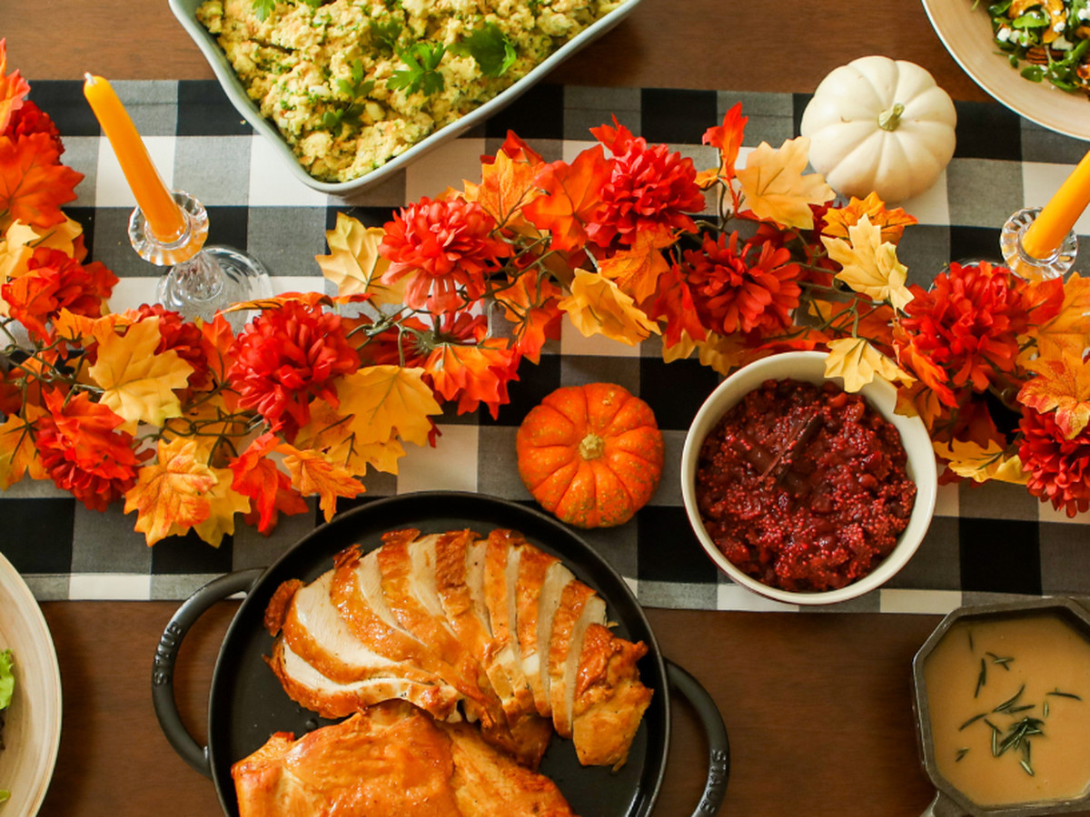 An autumnal tablescape with Thanksgiving goods.