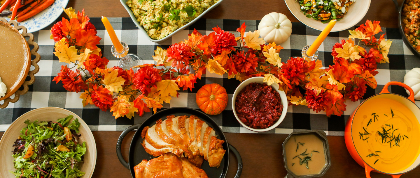 An autumnal tablescape with Thanksgiving goods.